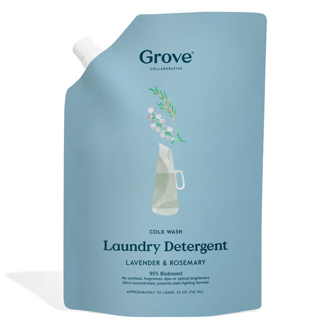 A light blue pouch of Grove Co. Cold Wash Liquid Laundry Detergent with a lavender-rosemary scent, made from plant-based ingredients. Its minimalist design features a small illustration of lavender in a vase and contains 24 fl oz for about 33 loads.