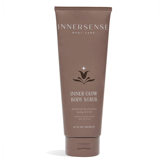 The 200 ml brown tube of Inner Glow Body Scrub by Innersense Organic Beauty features an exfoliating gel with enzymatic exfoliators and a subtle decorative label graphic.