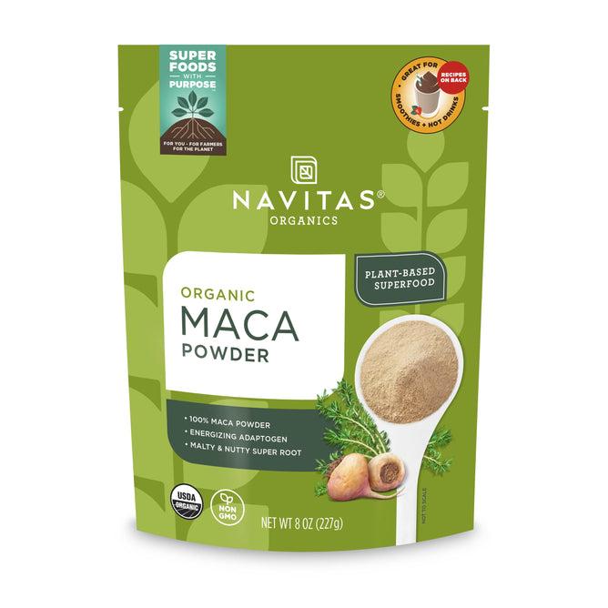 A green package of Navitas Organics Organic Maca Powder showcases its Peruvian adaptogen benefits, featuring a spoon with powder, maca roots, and labels such as USDA Organic, Non-GMO, and Plant-Based Superfood.