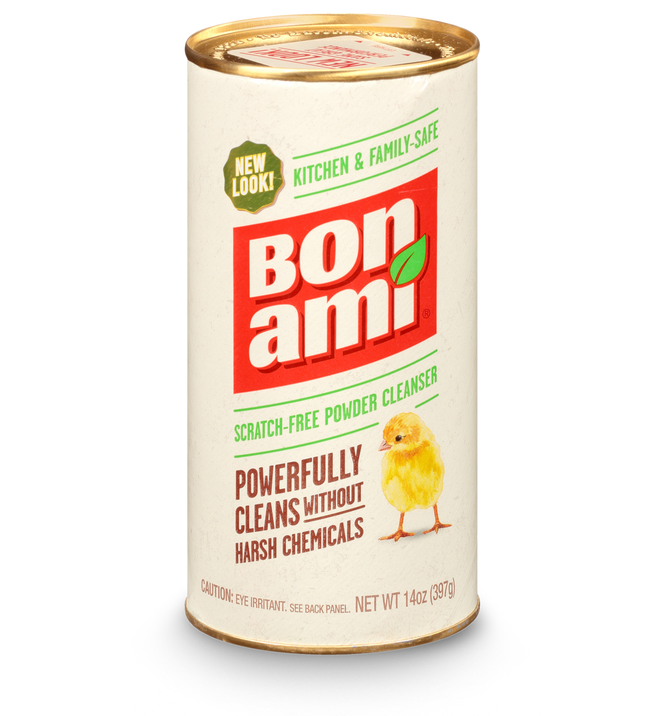 The Bon Ami Powder Cleanser comes in a cylindrical container, featuring a yellow chick illustration. Its label highlights Scratch-Free, Kitchen & Family Safe, and Powerfully Cleans Without Harsh Chemicals. Made with sustainable agents, the cleanser weighs 14 oz (397g).