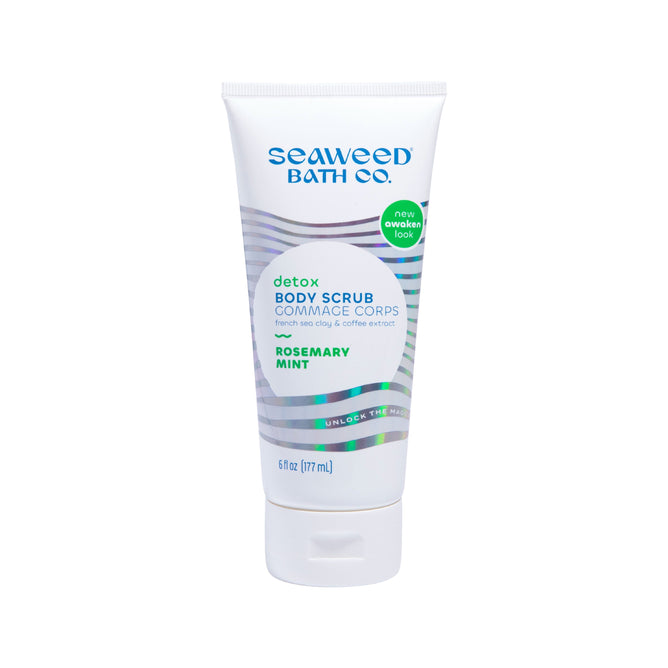 A 6 fl oz (177 ml) tube of The Seaweed Bath Cos Detox Exfoliating Body Scrub in Rosemary Mint includes French clay, coffee extract, and bladderwrack seaweed. It boasts a new logo and design, offering refreshing rejuvenation.