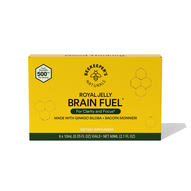 Beekeepers Naturals Royal Jelly Brain Fuel comes in a yellow box with hexagonal designs, promoting clarity and focus through honey-infused adaptogens. Featuring Ginkgo Biloba and Bacopa Monnieri, it includes six 10ml vials for a total of 60ml.