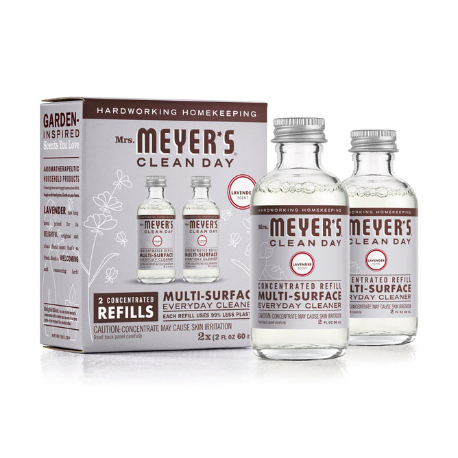 Box of Mrs. Meyers Multi-Surface Concentrate Refills includes two glass lavender-scented refills, showcasing garden-inspired scents and essential cleaning solutions.