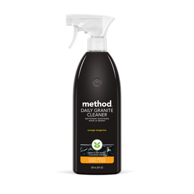 The Method Daily Granite Cleaner is a black spray bottle with a white nozzle, perfect for marble and granite surfaces. Its label shows the brand name method and describes it as orange tangerine for cleaning natural stone, with an 828 ml (28 fl oz) capacity.