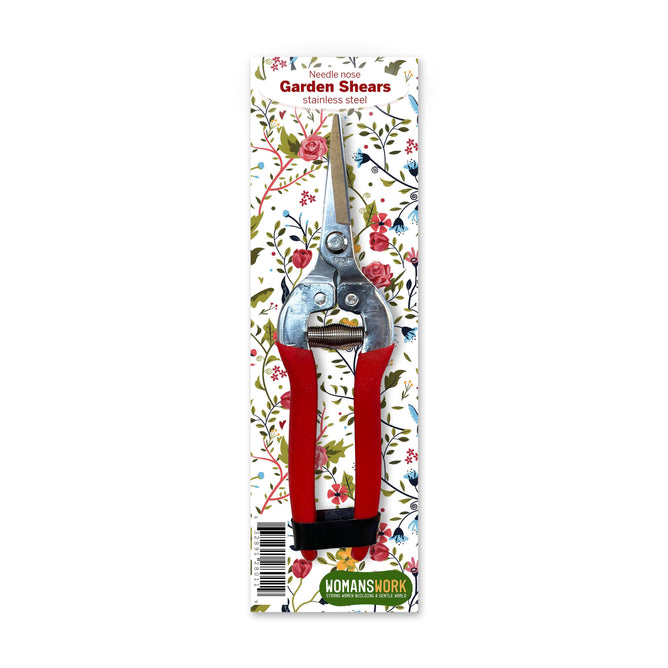 Compact pruning shears with red handles are placed on a floral background. The text states: Stainless Steel Shears, perfect for precision cutting. Branding label reads Womanswork.