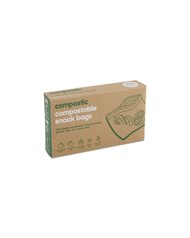 A box of Compostic Snack Bags contains 20 home-compostable bags made from renewable plant-based materials. The minimalist brown packaging is adorned with green text and fruit images, highlighting its eco-friendly nature.