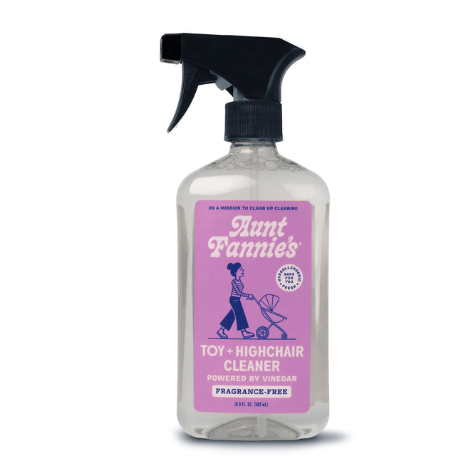 Aunt Fannies Toy + Highchair Cleaner is a vinegar-powered, fragrance-free spray bottle with a pink label featuring a person pushing a stroller, ideal for cleaning toys and highchairs.
