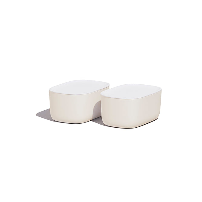 Two modern, white, rounded rectangular Small Storage Bins by Open Spaces sit side by side on a white background, casting a soft shadow to the left—ideal for those seeking stylish solutions for organizing small items.