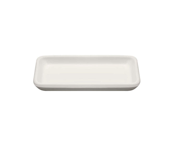 The Ceramic Keep Tray by Full Circle is a rectangular white ceramic tray with rounded edges, a flat surface, and a no-slip base for stability.