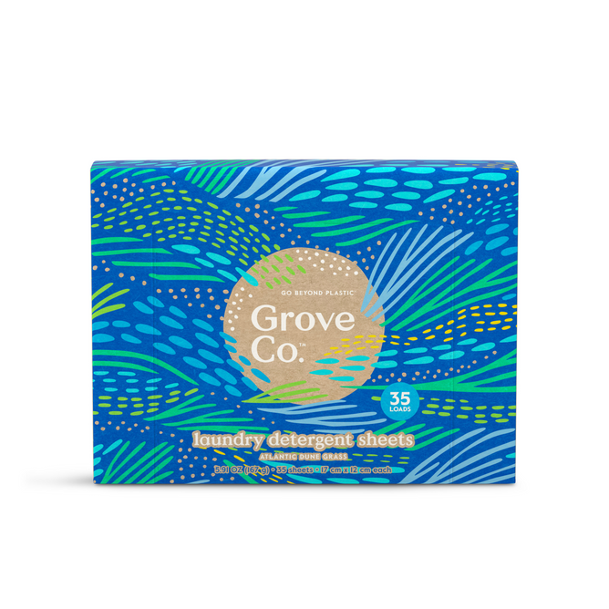 A box of Grove Co. Laundry Sheets - Spring Collection, from Grove Collaboratives eco-friendly line, sits on a white background. The blue package with vibrant green and yellow patterns claims 35 loads and highlights its message to Go Beyond Plastic, supporting the fight against plastic pollution.