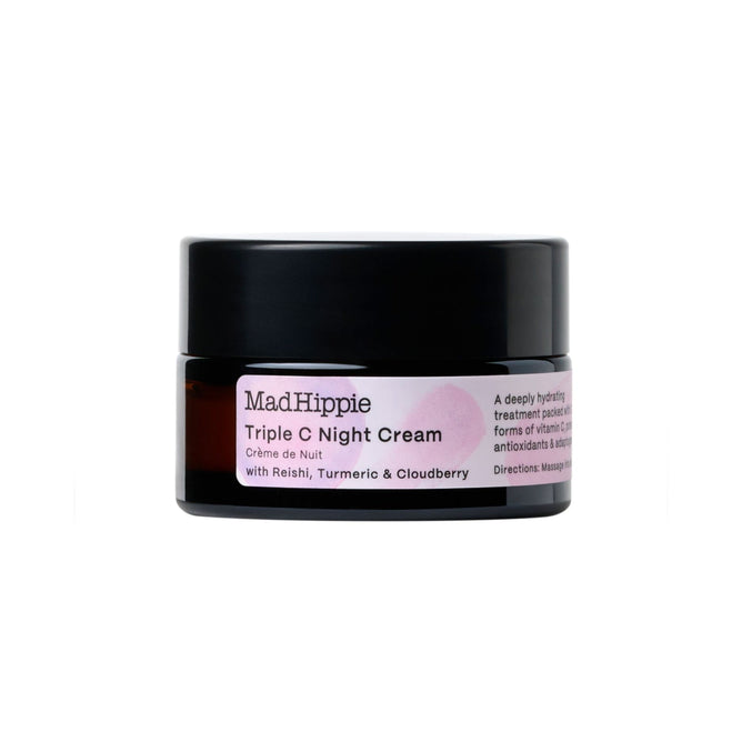 A dark jar with a white label displays Mad Hippies Triple C Night Cream, infused with potent ingredients like Reishi, Turmeric, and Cloudberry. Enhanced with vitamin C, its simple yet elegant packaging beautifully reflects a commitment to natural skincare.