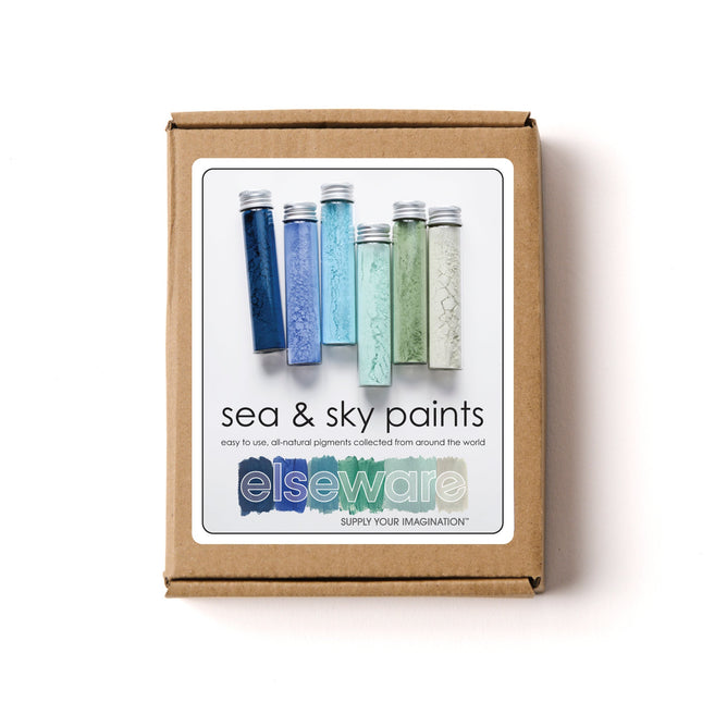 The Sea & Sky Paint Set from elseware includes five vials with blue, green, and beige shades. The label promises easy to use, all-natural, earth-friendly pigments collected globally, ideal for those preferring non-toxic pigments.