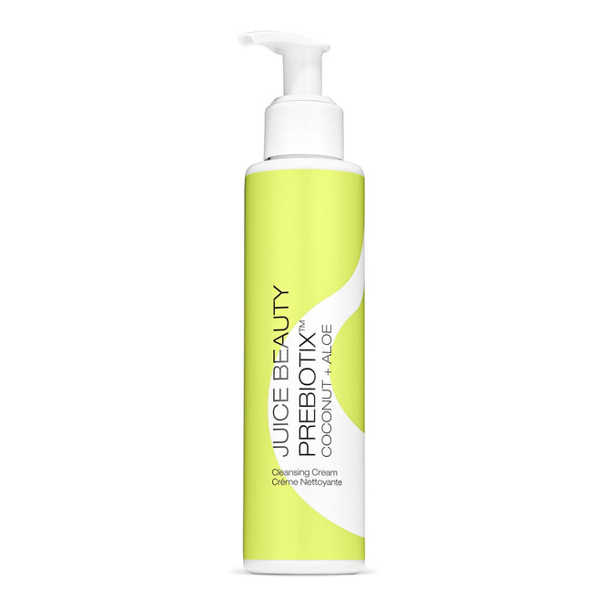 The white pump bottle of Juice Beauty’s Prebiotix Coconut + Aloe Cleansing Cream is designed for balanced skin. Its label has a green background with white text displaying the product name and brand information.