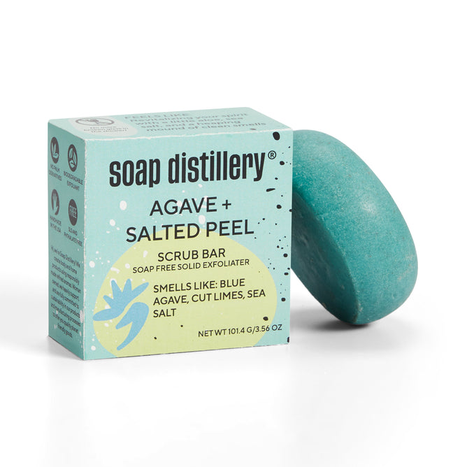 A blue Body Scrub Bar by Soap Distillery with Agave + Salted Peel scent is a plastic-free, soap-free exfoliator featuring blue agave, cut limes, and sea salt to gently exfoliate and moisturize. Net weight: 101.4g/3.56oz.