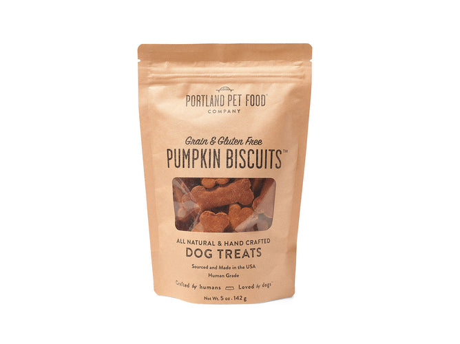 A brown paper bag of Portland Pet Food Companys Grain & Gluten-Free Dog Biscuits showcases their 100% whole food, human-grade ingredients. Hand-crafted with all-natural Pacific Northwest ingredients, including Bobs Red Mill Flour, these USA-made treats are visible through a window on the package.