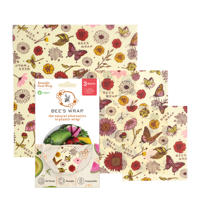 Bee’s Wrap Vegan Assorted Wraps—three reusable, plant-based wraps in small, medium, and large with a floral and butterfly design—are shown alongside packaging and wrapped produce.