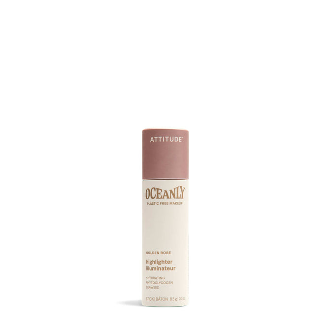 ATTITUDE Oceanly Highlighter stands upright on a white background—a plastic-free, hydrating makeup stick made with naturally sourced ingredients, beige body, and dusty pink cap.
