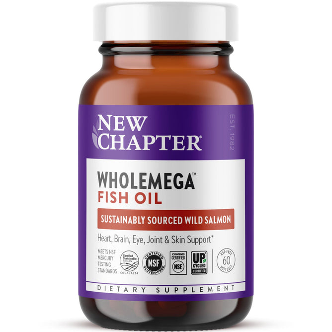 A brown bottle of New Chapter Wholemega™ Fish Oil, made from sustainably caught Wild Alaskan Salmon, features a purple and white label promoting Omega-3 for heart, brain, eye, joint & skin support. Contains 60 softgels.