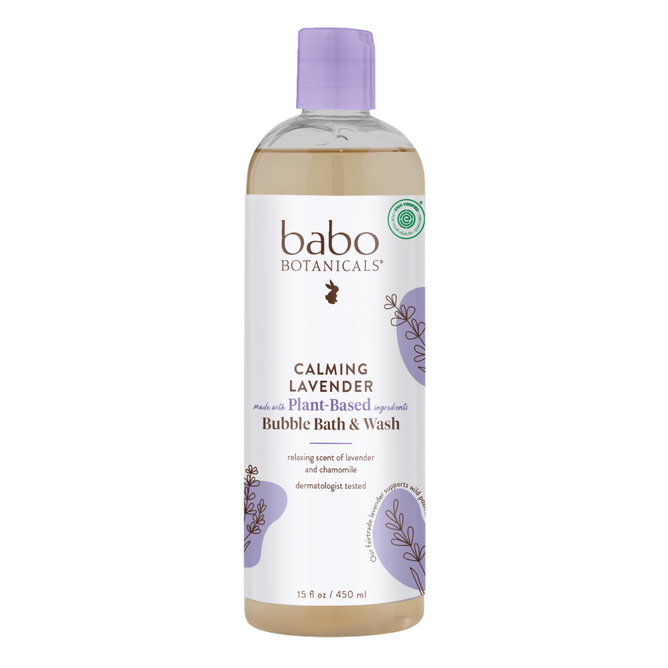 The image shows a 15 oz transparent bottle of Babo Botanicals Calming Bubble Bath & Wash, featuring lavender imagery on its label. The product is emphasized for its plant-based, dermatologist-tested ingredients, ideal for aromatherapy, and comes with a purple cap.