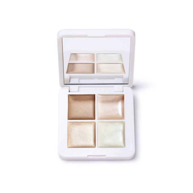 The RMS Beauty Living Luminizer Glow Quad Mini is an open white compact with four shimmery cream luminizers in a square layout and a built-in mirror, perfect for highlighting skin.