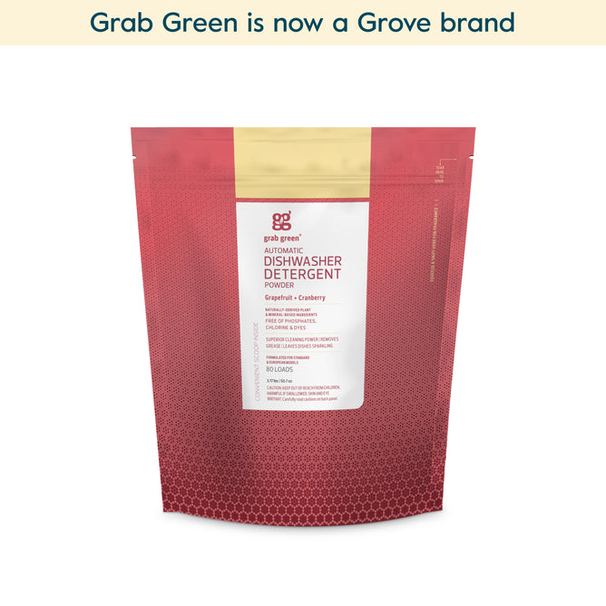 A red pouch of grab green Automatic Dishwashing Detergent Powder - Grapefruit with Cranberry (Coming Soon!) sits on a white background. Text above reads: Grab Green is now a Grove brand—enjoy spot-free dishes and powerful grease removal.
