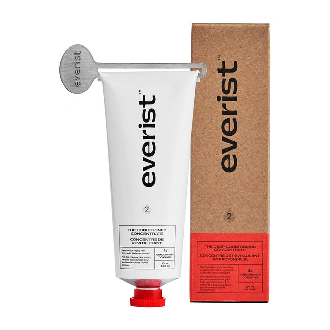 A white tube labeled Everist The Deep Conditioning Concentrate with a red cap and metal key is shown next to a matching brown Everist box. The tube indicates its a deep conditioning concentrate.
