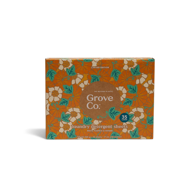 A box of Grove Co. Laundry Sheets - Fall Collection features orange packaging with white and yellow flowers, green leaves, 35 pre-measured sheets per box, odor elimination, and is a limited edition.