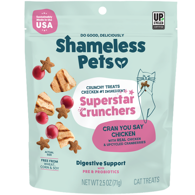 A teal 2.5 oz pouch of Shameless Pets Cran You Say Chicken Cat Treats features chicken and cranberry images, a cartoon cat, and text about digestive support, probiotics, and antioxidants.
