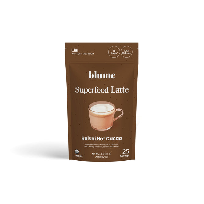 A brown pouch of blume Organic Reishi Hot Cacao Latte Powder features a mug of foamy hot chocolate. This adaptogen-rich mix offers Chill, 1g sugar, low caffeine, and contains 25 servings per package.