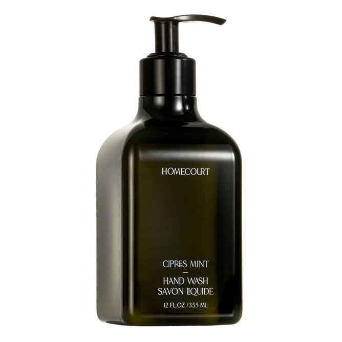 A dark green rectangular pump bottle labeled Homecourt Hand Wash, containing 12 fl oz (355 mL) of luxurious liquid soap made with eco-friendly ingredients.