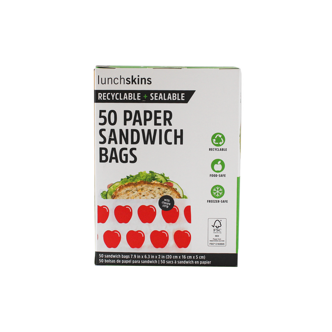 A box of Lunchskins Paper Sandwich Bags (VIP Discount) offers recyclable, sealable, food safe, and freezer safe storage in a sandwich bag with red apple designs on the packaging.