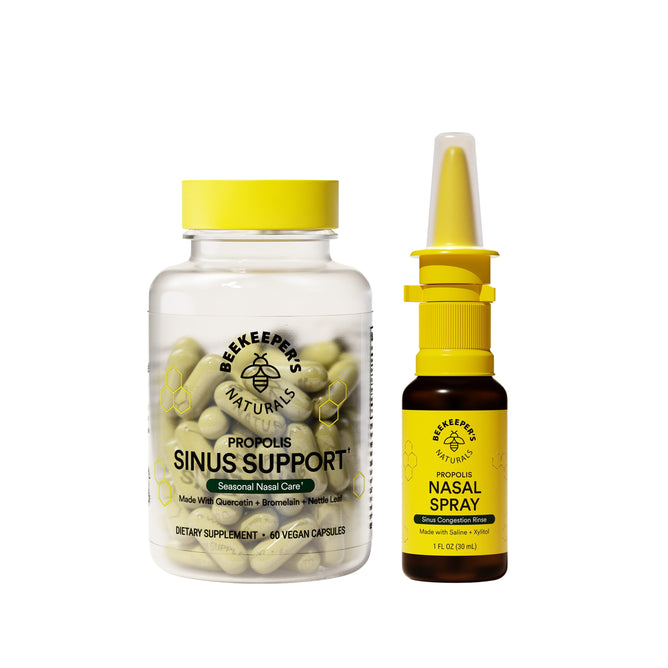 A jar of Beekeepers Naturals Sinus Support sits next to a bottle of Propolis Nasal Spray, both designed for seasonal nasal care with natural ingredients. They effectively balance histamine levels, and the nasal spray has a unique yellow nozzle.