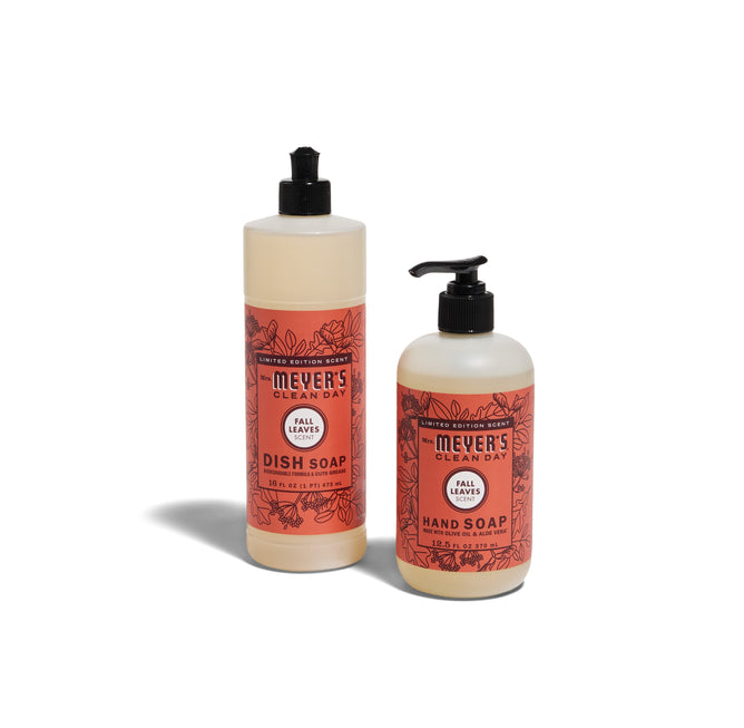 Mrs. Meyer’s Crisp & Clean Sinkside Set - Fall Leaves features a tall dish soap with a black flip cap and a shorter hand soap with a pump, both on a white background.