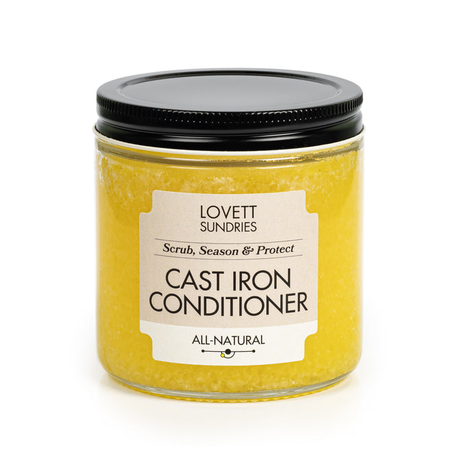 Lovett Sundries Cast Iron Conditioner, with a black lid, promises to scrub, season, and protect your cast iron cookware. This yellow, all-natural solution maintains a natural non-stick surface on your pans and is ready for use.