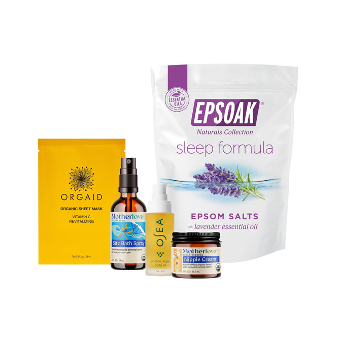 The Grove Collaborative New Mom Bath & Body Ritual Collection features wellness essentials like a yellow Orgaid sheet mask, spray bottle, essential oil, Motherlove Nipple Cream, and Epsoak sleep formula Epsom salts for soothing self-care.