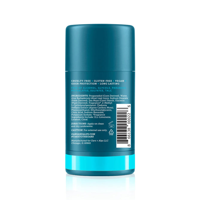 Oars + Alps Natural Deodorant comes in a turquoise, cylindrical, aluminum-free container with a label showing ingredients, directions, and claims such as cruelty-free, vegan, and odor-preventing—honored as a Mens Health Editors Choice.
