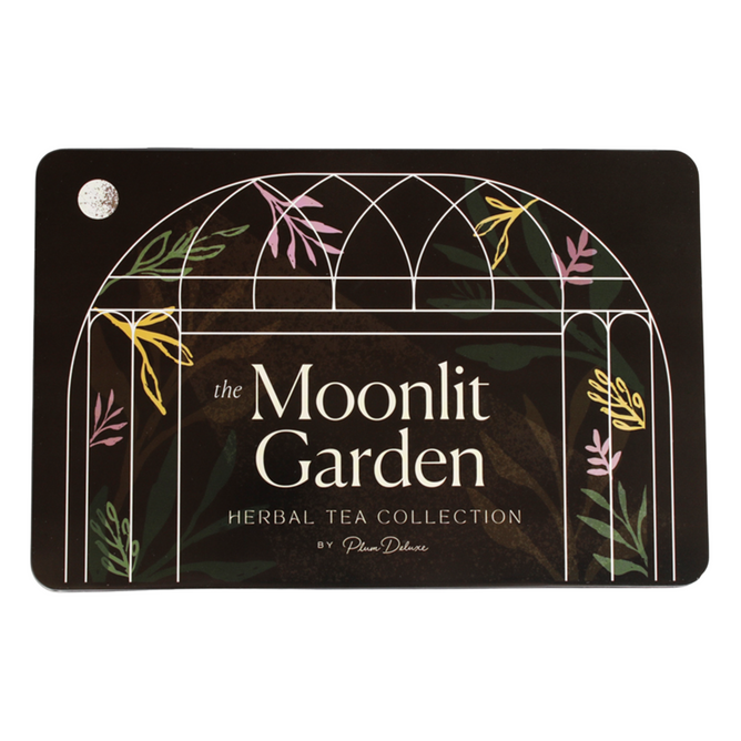 The Tea Gift Tin - Moonlit Garden by Plum Deluxe features a white arch with illustrated leaves and flowers—an elegant tin from the Moonlit Garden Collection, perfect for herbal tea lovers.