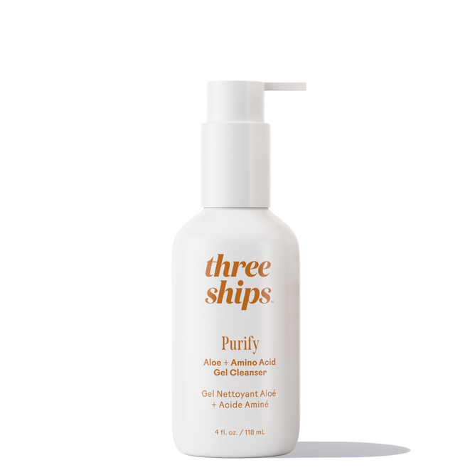 A white pump bottle labeled Three Ships Purify Aloe + Amino Acid Gel Cleanser in gold text stands upright on a white background. This sulfate-free cleanser with Aloe Vera Juice is 4 fl. oz. (118 mL).