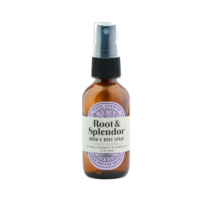 A brown glass spray bottle of Root and Splendor Room and Body Spray, Hush Blend with natural essential oils like lavender, rosemary, and sandalwood, designed to support emotional well-being, shown against a white background.