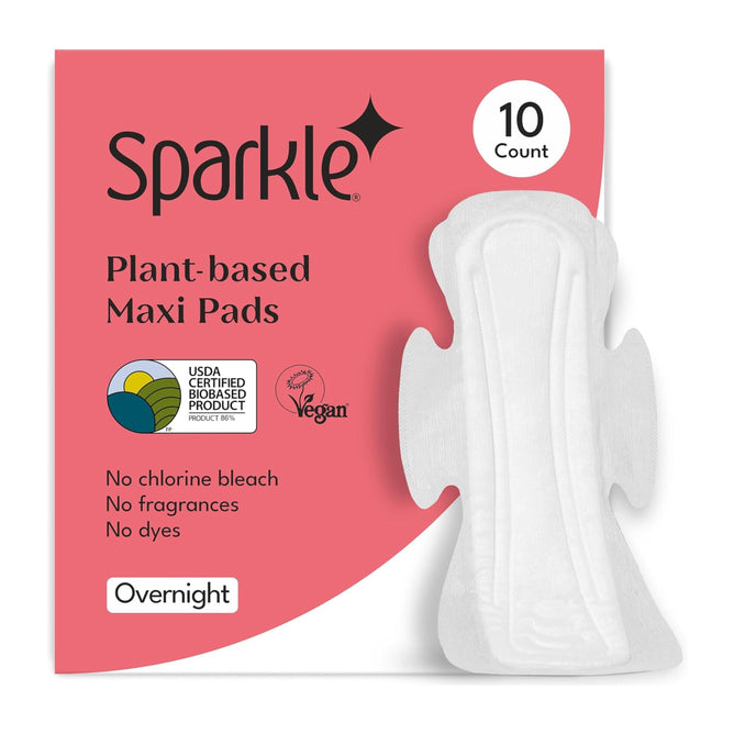 A 10-count package of Sparkle Maxi Pads with Wings features pink packaging, a pad image, and labels like USDA Certified Biobased Product, vegan, plant-based, hypoallergenic, and free from chlorine bleach, fragrances, or dyes.