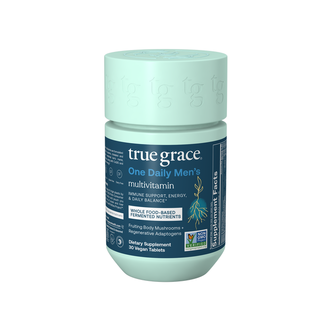 True Grace One Daily Mens Multivitamin comes in a teal bottle with a blue label, offering immune support, energy, and daily balance from chelated and fermented minerals plus an organic mushroom blend in 30 vegan tablets. Certification logos are included.