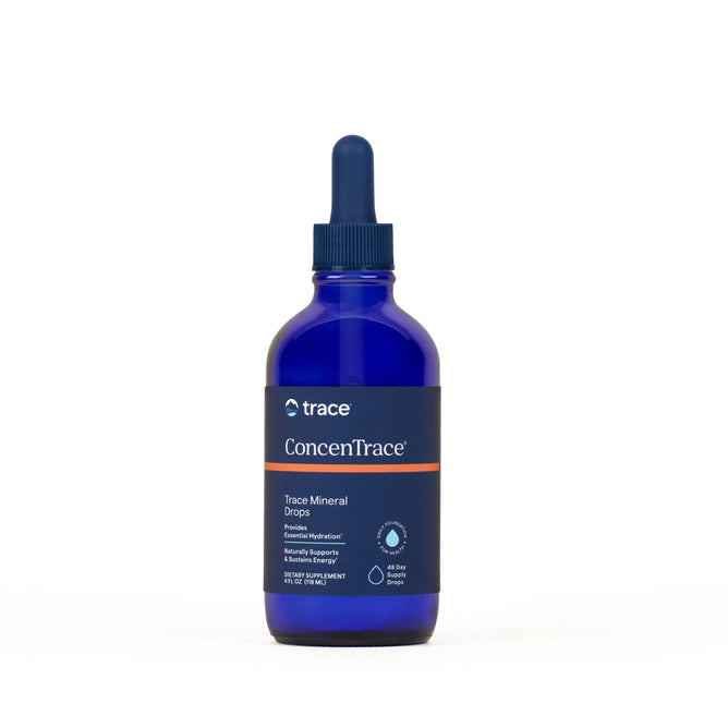A blue glass bottle of Trace Minerals ConcenTrace Trace Mineral Drops with a dropper cap and dark label showing product details and branding, set against a plain white background.