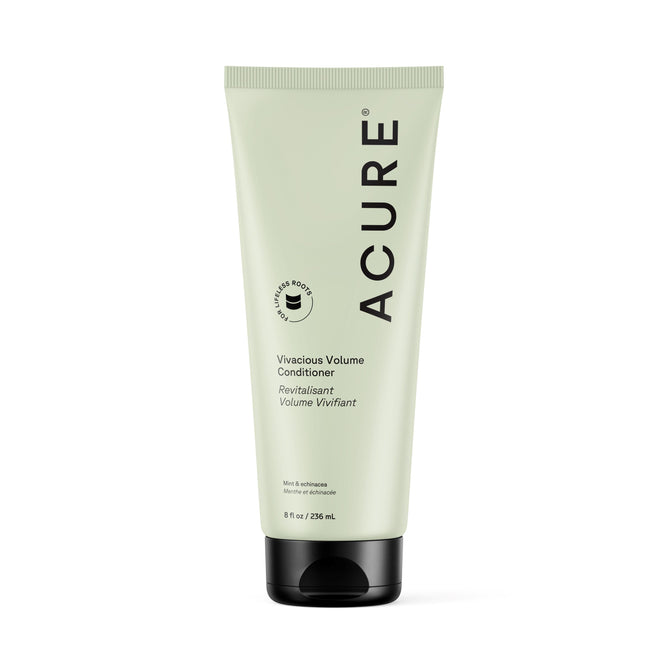 A light green tube of Acure Vivacious Volume Conditioner stands upright with black text and a black cap, featuring product details and the Acure logo on a white background.