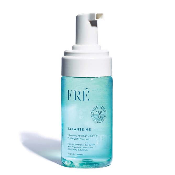 Transparent bottle with a white pump labeled FRÉ Skincare CLEANSE ME. Features text: Foaming Facial Cleanser & Makeup Remover. Contains 3.38 fl oz (100 ml), ideal for active skin. The light blue liquid is enriched with micellar water.
