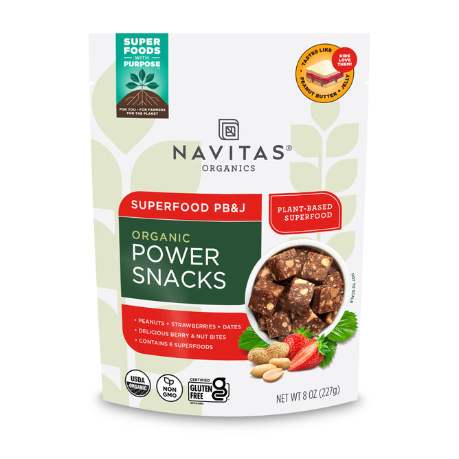 A package of Navitas Organics Organic Power Snacks PB&J features images of peanuts, strawberries, and dates. This plant-based, non-GMO, gluten-free superfood is USDA organic and offers a nutritious snack option. Contains 8 oz (227g).