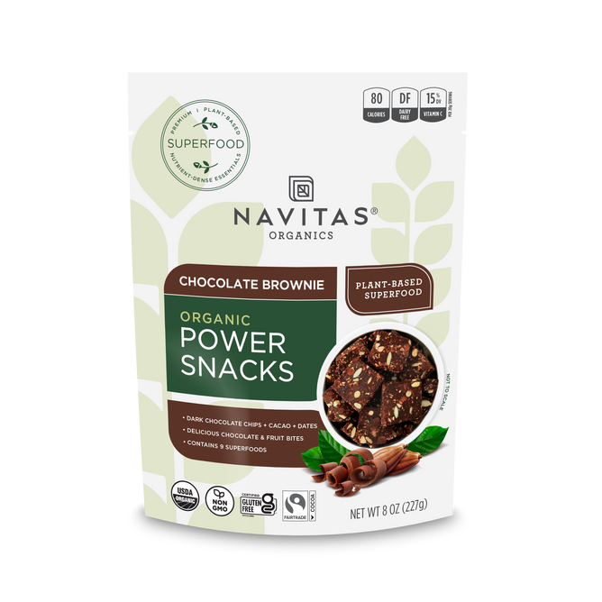 A Navitas Organics Power Snacks Chocolate Cacao standing pouch in Chocolate Brownie flavor. The white package with green accents features snack and cacao images, showcasing plant-based superfood and non-GMO certifications. Perfect for an energizing snack!.