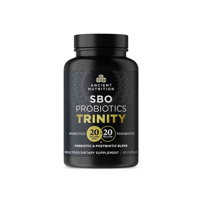 The SBO Probiotic - Trinity by Ancient Nutrition is presented in a black bottle, highlighting 20 billion CFU probiotics and parabiotics. It contains 60 capsules of a prebiotic-postbiotic blend aimed at boosting digestive and gut health.