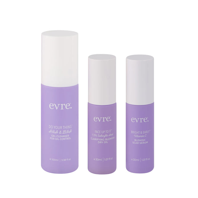 Three purple skincare bottles with white caps from evre. are displayed as the Blemish Set, labeled Do Your Thing AHA & BHA Gel Cleanser, Face Up to It Clarifying Blemish Dry Oil, and Bright & Early Vitamin C Scar Serum.