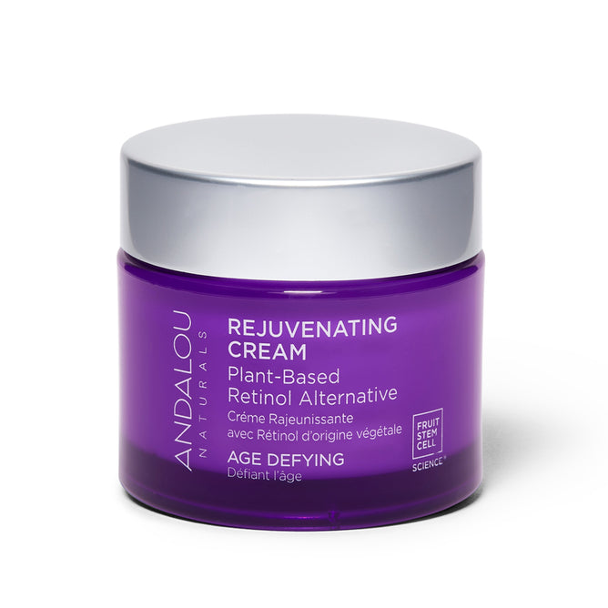 Andalou Naturals Age Defying Rejuvenating Plant Based Retinol Alternative Cream, packaged in purple, features bakuchiol as a plant-based retinol alternative and highlights fruit stem cell science.