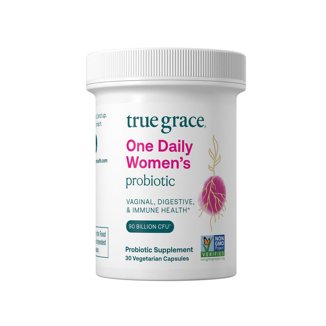 A white bottle labeled True Grace One Daily Womens Probiotic emphasizes benefits for vaginal, digestive, and immune health. It contains 30 vegetarian capsules with probiotics and features a Non-GMO Verified logo to ensure purity.